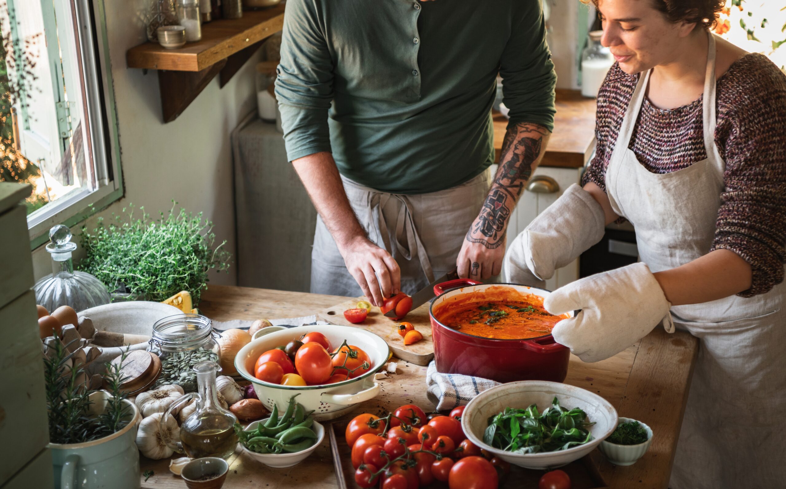 Couple making a tomato soup
